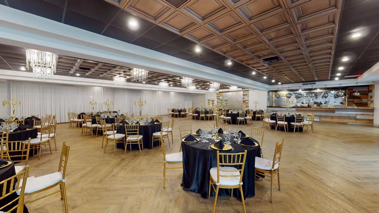 Corporate room with round tables and an architectural ceiling